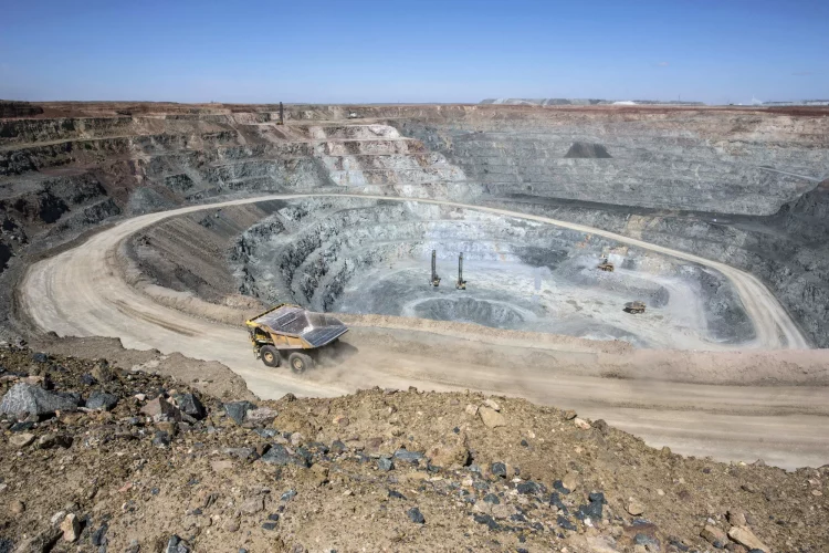 Are Commodity Booms Shielding Emerging Markets from Rate Hikes?